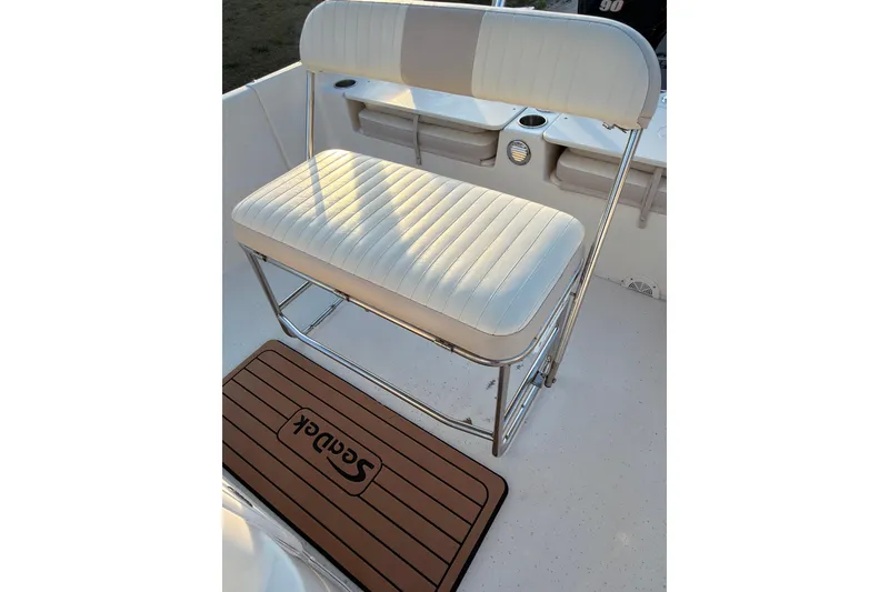 Slide: The Image of White cushioned seat on 2013 Carolina Skiff 198 DLV boat interior. - 10
