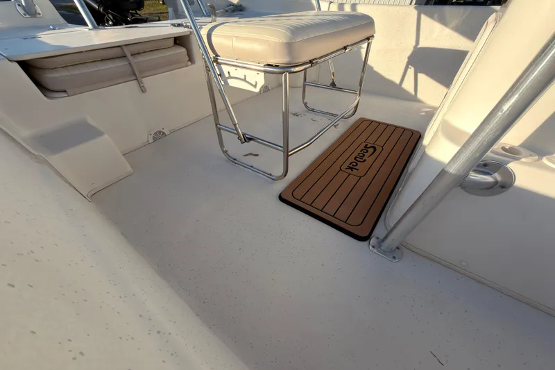 Slide: The Image of 2013 Carolina Skiff 198 DLV boat interior with seating and SeaDek mat. - 11