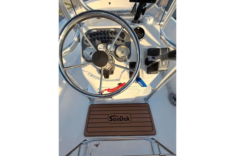 Slide: The Image of Steering console of a 2013 Carolina Skiff 198 DLV boat with SeaDek mat. - 15