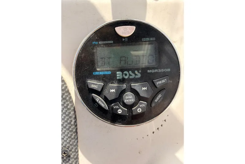 Slide: The Image of Close-up of a Boss MGR350B audio system on a 2013 Carolina Skiff 198 DLV boat. - 17