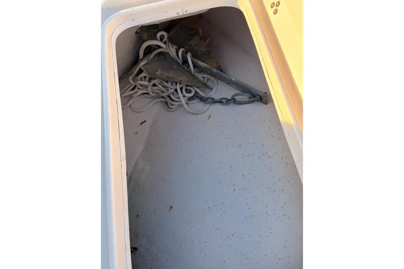 Slide: The Image of Anchor and rope storage in 2013 Carolina Skiff 198 DLV boat compartment. - 28