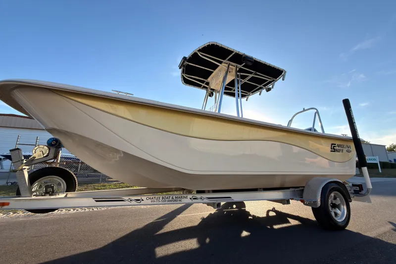 Slide: The Image of 2013 Carolina Skiff 198 DLV boat on trailer, sunny day background. - 3