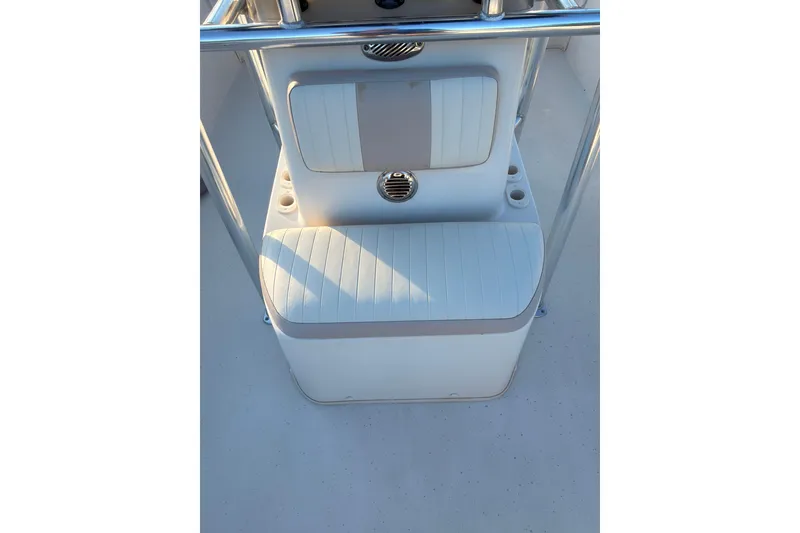 Slide: The Image of 2013 Carolina Skiff 198 DLV boat seating area with cup holders and padded cushions. - 7