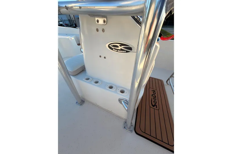 Slide: The Image of 2013 Carolina Skiff 198 DLV boat interior with rod holders and SeaDek flooring. - 8