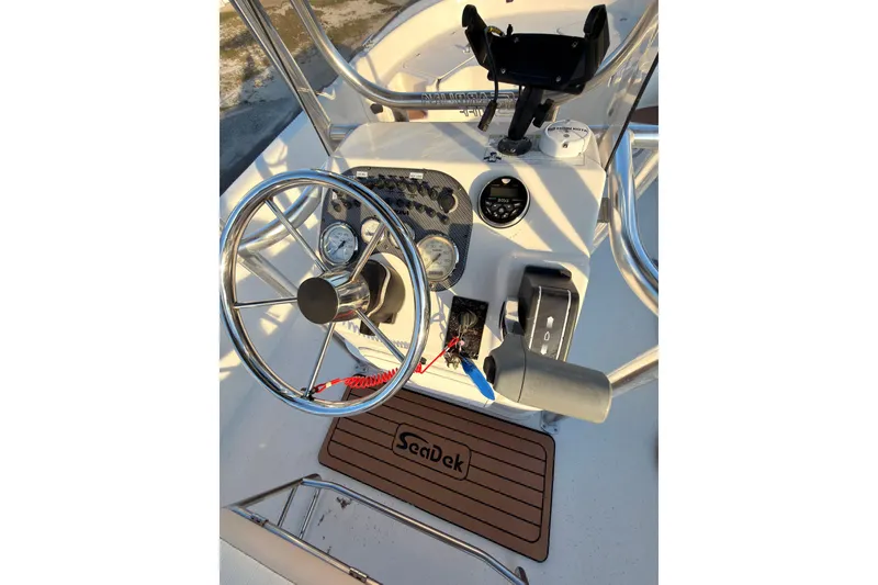 Slide: The Image of Steering console of a 2013 Carolina Skiff 198 DLV with SeaDek mat. - 9
