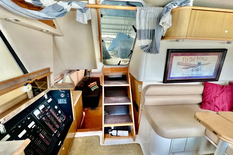 Slide: The Image of Interior of 2001 Bayliner 4788 Pilot House Motoryacht with cozy seating and nautical decor. - 16