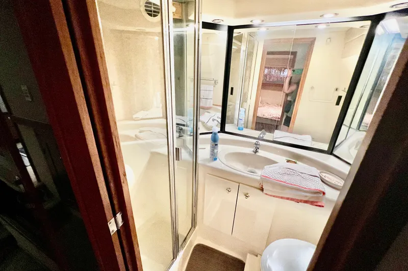 Slide: The Image of Bathroom interior of 2001 Bayliner 4788 Pilot House Motoryacht with sink and mirror. - 18