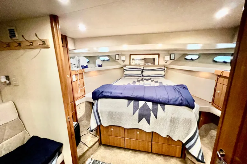 Slide: The Image of Interior of 2001 Bayliner 4788 Pilot House Motoryacht with cozy bedroom and nautical decor. - 20