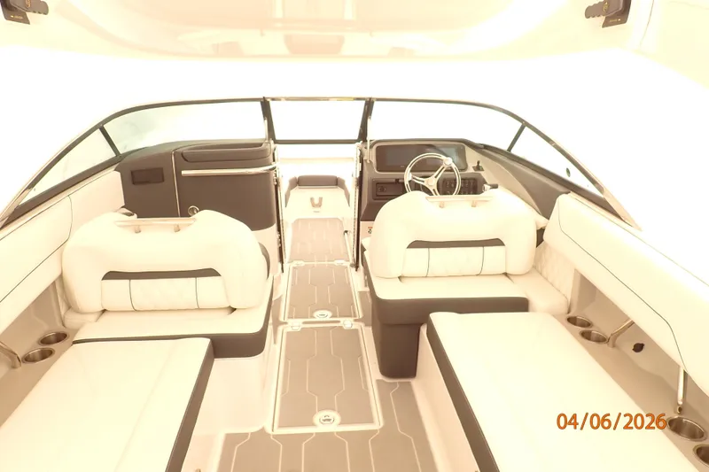 Slide: The Image of 2025 Regal LX6 boat interior with modern seating and steering wheel, dated April 6, 2026. - 3