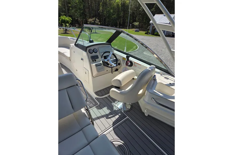 Slide: The Image of 2018 Boston Whaler 230 Vantage boat interior with steering wheel and seating. - 10