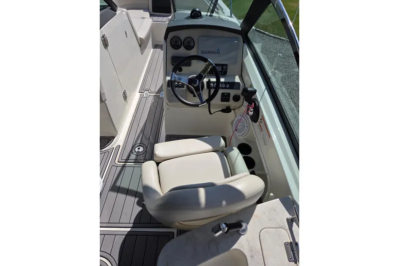 Slide: The Image of Interior view of 2018 Boston Whaler 230 Vantage boat cockpit with Garmin navigation system. - 11