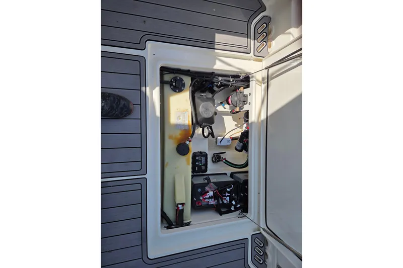 Slide: The Image of 2018 Boston Whaler 230 Vantage boat interior compartment with wiring and components. - 13