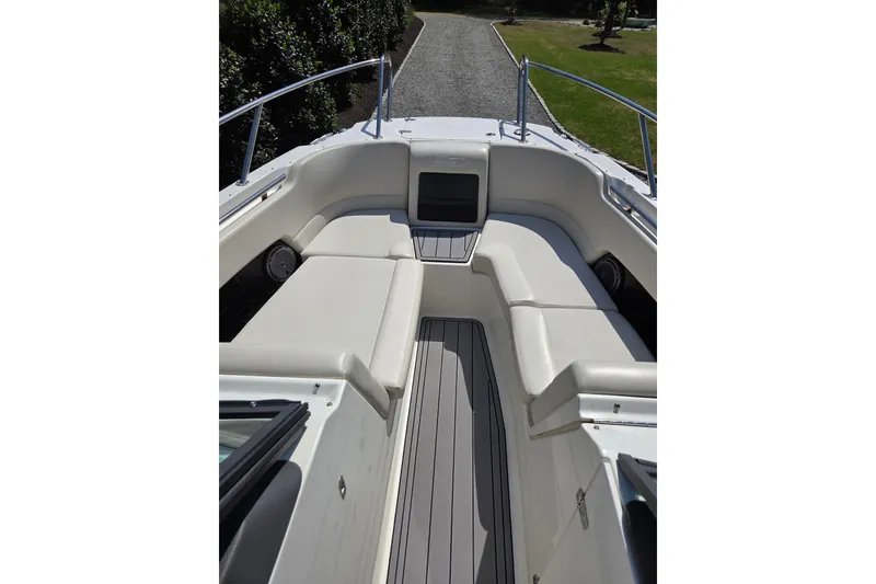 Slide: The Image of 2018 Boston Whaler 230 Vantage boat interior with cushioned seating and sleek design. - 14