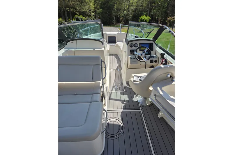 Slide: The Image of Interior view of 2018 Boston Whaler 230 Vantage boat, featuring sleek seating and modern controls. - 19