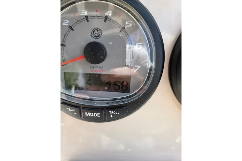 Slide: The Image of Close-up of a 2018 Boston Whaler 230 Vantage tachometer showing 158 hours. - 21