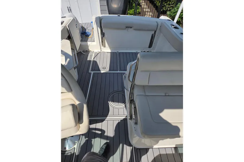 Slide: The Image of 2018 Boston Whaler 230 Vantage boat interior with cushioned seating and sleek flooring. - 3
