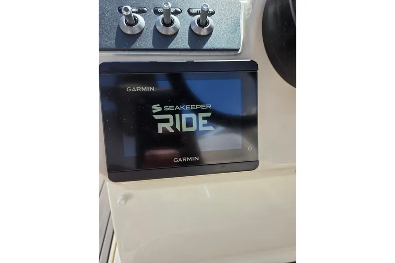 Slide: The Image of Garmin Seakeeper Ride display on 2018 Boston Whaler 230 Vantage boat dashboard. - 36