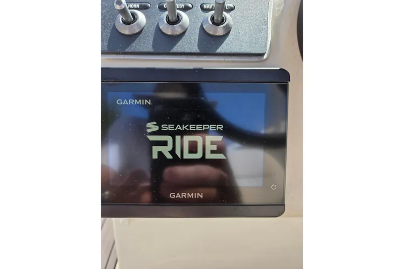 Slide: The Image of Garmin Seakeeper Ride display on 2018 Boston Whaler 230 Vantage boat dashboard. - 37