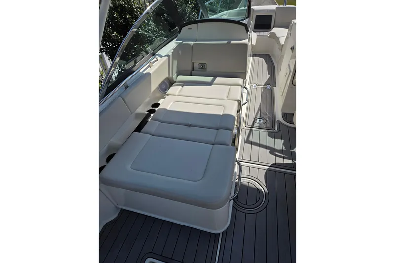 Slide: The Image of 2018 Boston Whaler 230 Vantage interior with cushioned seating and sleek deck design. - 8