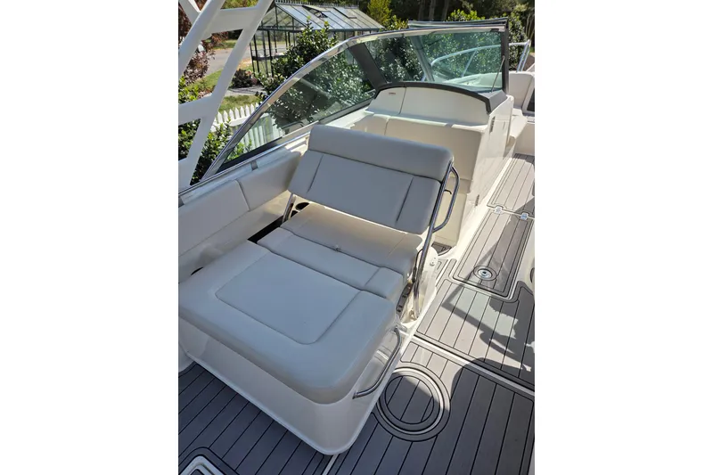Slide: The Image of 2018 Boston Whaler 230 Vantage boat interior with cushioned seating and sleek design. - 9