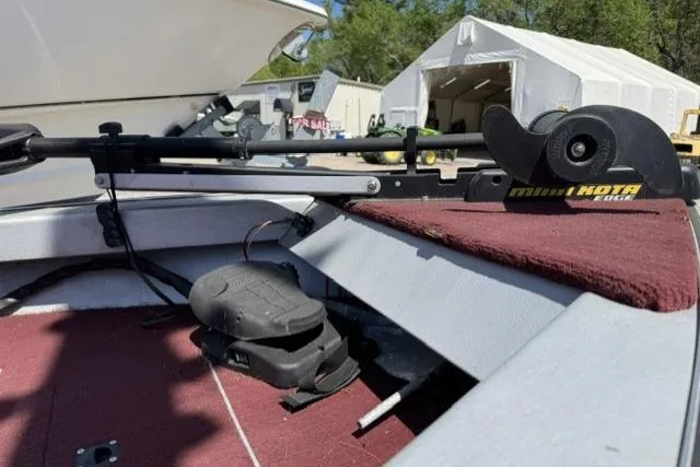 Slide: The Image of 1993 Lund 1700 Pro Angler boat with Minn Kota trolling motor on red carpeted deck. - 4