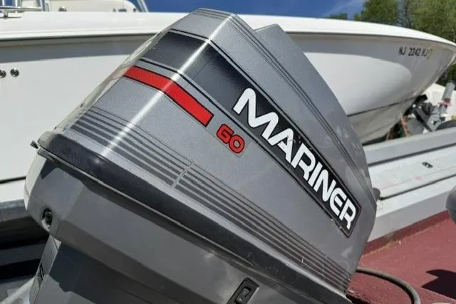 Slide: The Image of Mariner 60 outboard motor on a 1993 Lund 1700 Pro Angler boat. - 6