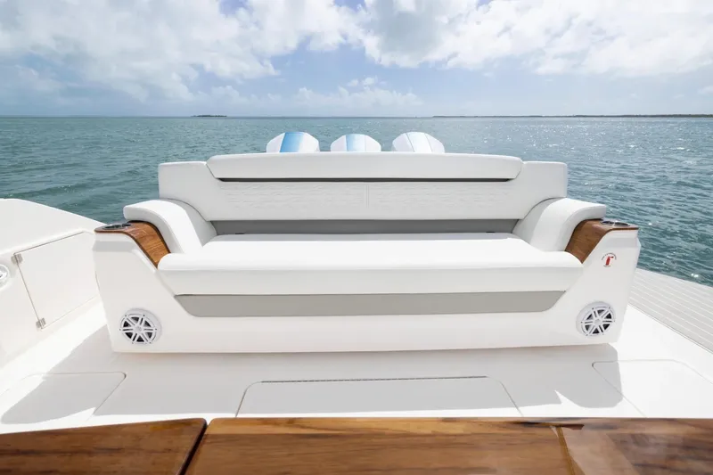 Slide: The Image of Manufacturer Provided Image: Luxury seating on 2026 Tiara Yachts 46 LS, overlooking serene ocean waters. - 10