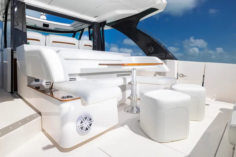 Slide: The Image of Manufacturer Provided Image: Luxurious 2026 Tiara Yachts 46 LS interior with elegant white seating and table. - 13