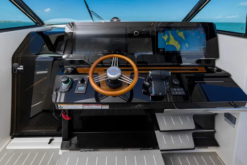 Slide: The Image of Manufacturer Provided Image: Helm of 2026 Tiara Yachts 46 LS with advanced navigation displays and controls. - 15