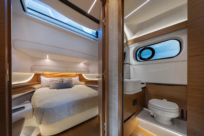 Slide: The Image of Manufacturer Provided Image: Luxurious interior of 2026 Tiara Yachts 46 LS, featuring a cozy bedroom and modern bathroom. - 16