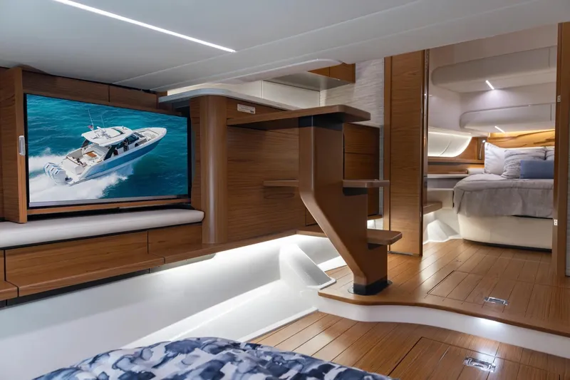 Slide: The Image of Manufacturer Provided Image: Luxurious interior of 2026 Tiara Yachts 46 LS with modern wood finishes and cozy bedding. - 17
