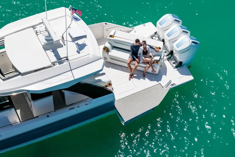 Slide: The Image of Manufacturer Provided Image: 2026 Tiara Yachts 46 LS on turquoise water, featuring spacious deck and powerful engines. - 3