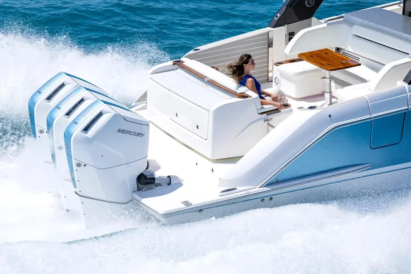 Slide: The Image of Manufacturer Provided Image: 2026 Tiara Yachts 46 LS cruising with powerful Mercury engines on blue ocean waters. - 4