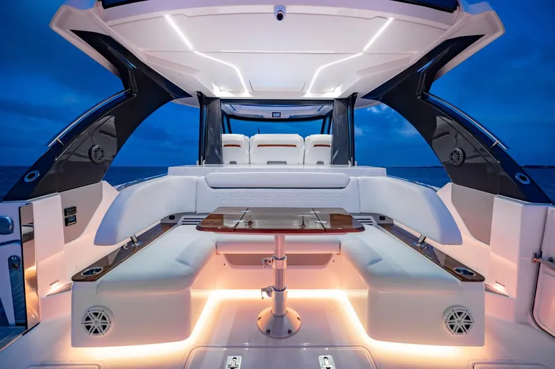 Slide: The Image of Manufacturer Provided Image: Luxurious 2026 Tiara Yachts 46 LS interior with ambient lighting and elegant seating. - 8