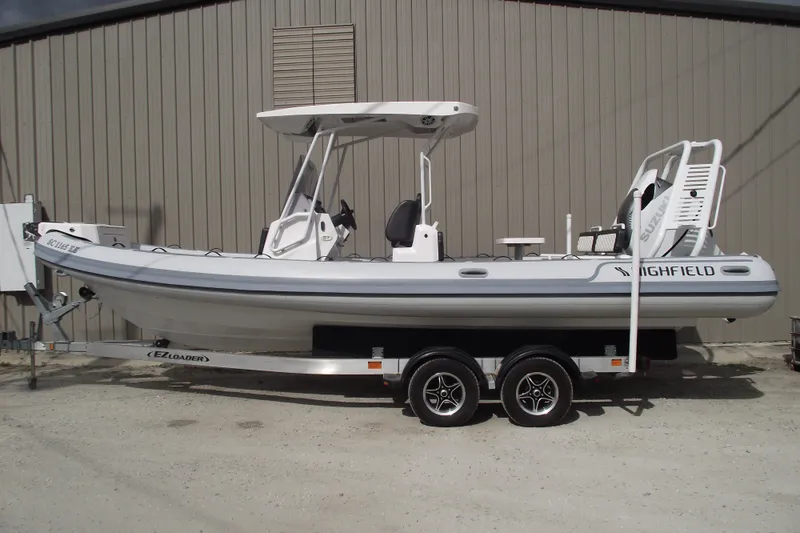 The Image of 2024 Highfield Sport 760 boat on trailer, parked outdoors. - 0