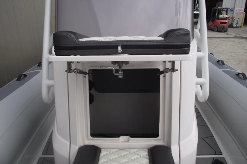 Slide: The Image of 2024 Highfield Sport 760 boat interior with storage compartment and seating. - 11