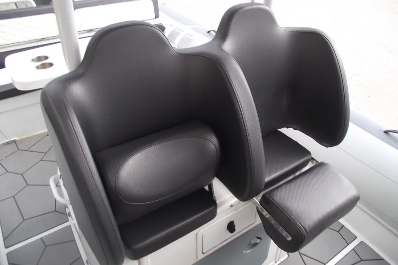 Slide: The Image of 2024 Highfield Sport 760 boat seats with sleek black upholstery and modern design. - 14