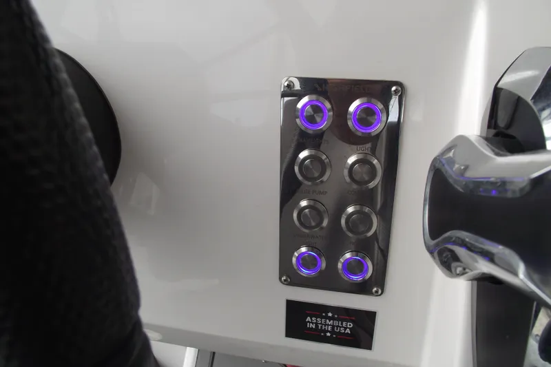 Slide: The Image of Control panel of 2024 Highfield Sport 760 boat with illuminated buttons. - 19