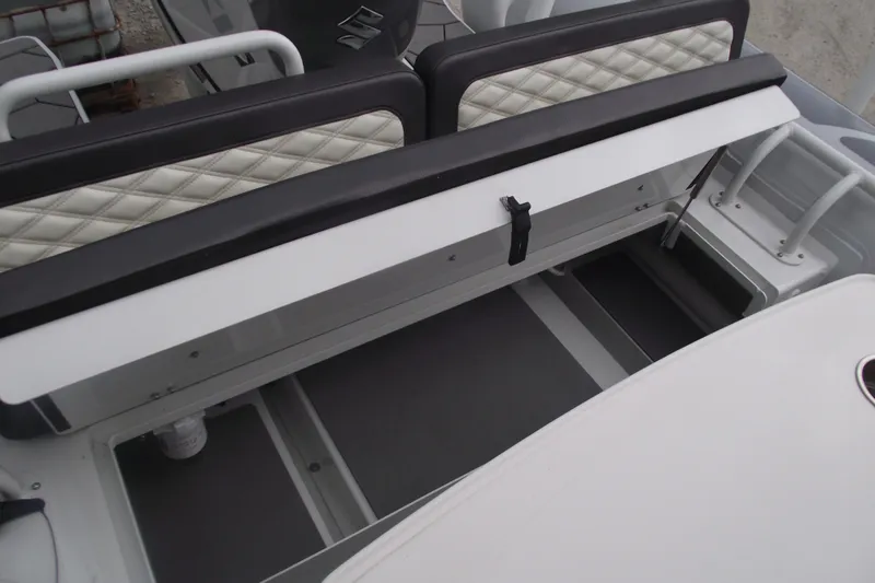 Slide: The Image of 2024 Highfield Sport 760 boat interior storage compartment with quilted seating. - 21