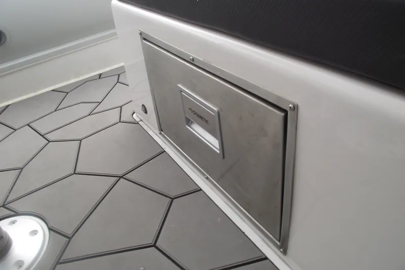 Slide: The Image of 2024 Highfield Sport 760 boat interior with sleek flooring and stainless steel compartment. - 23