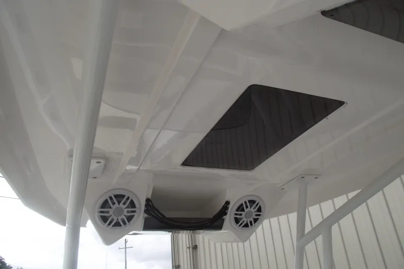 Slide: The Image of 2024 Highfield Sport 760 boat underside with speakers and sleek design. - 24