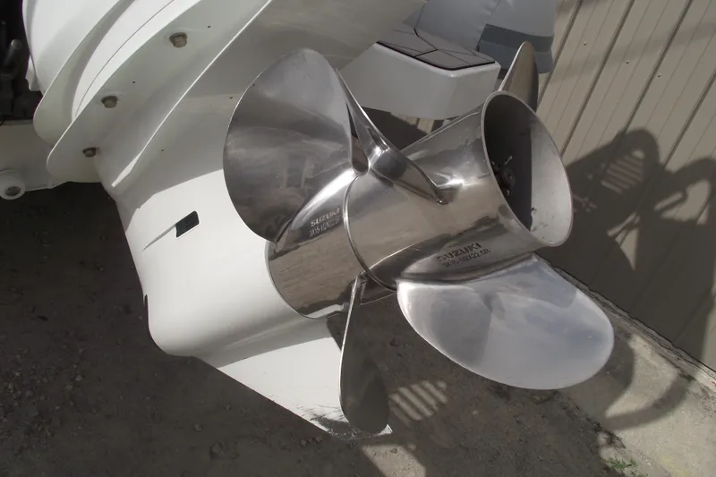 Slide: The Image of Close-up of a 2024 Highfield Sport 760 boat's stainless steel propeller. - 5