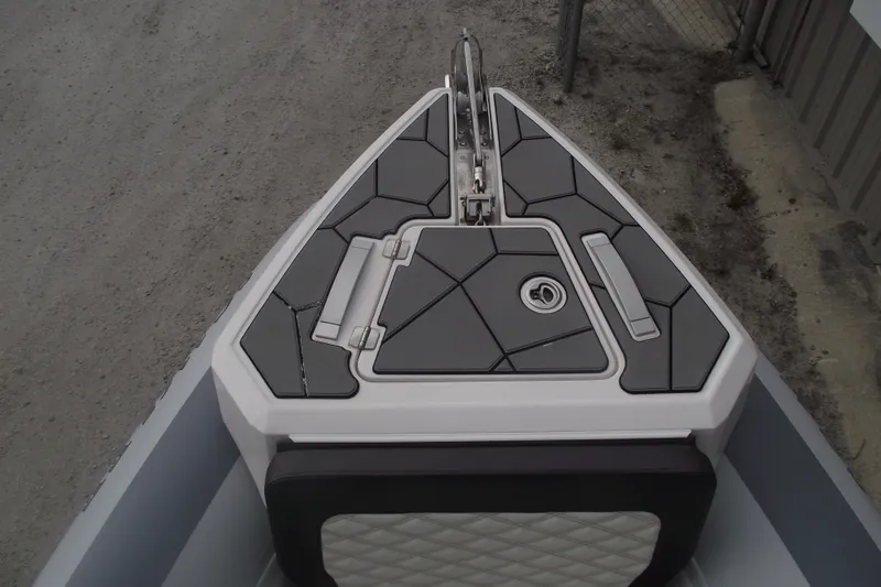 Slide: The Image of 2024 Highfield Sport 760 boat bow with sleek, modern design and geometric deck patterns. - 6