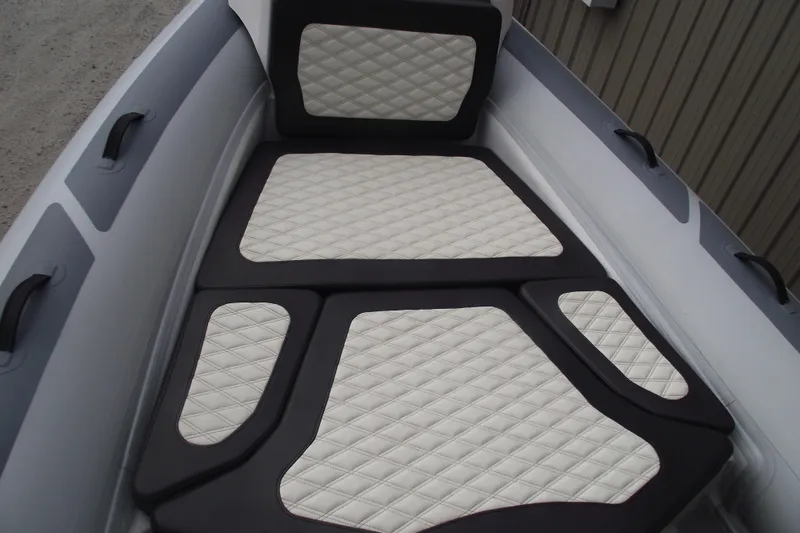 Slide: The Image of 2024 Highfield Sport 760 boat interior with quilted seating and sleek design. - 8