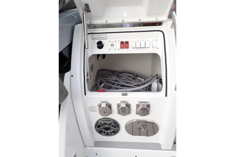 Slide: The Image of 2024 Formula 400 Super Sport Crossover boat utility compartment with controls and storage. - 10