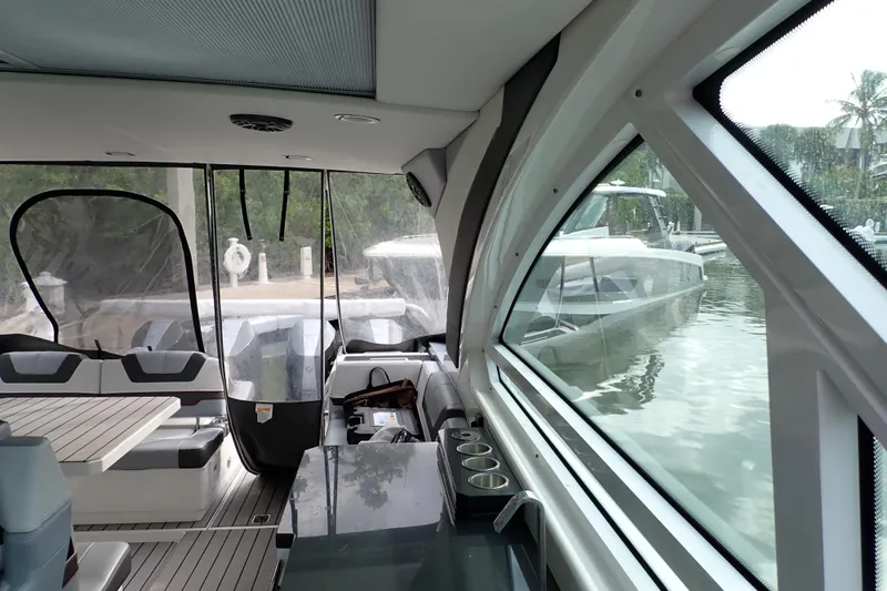 Slide: The Image of Interior view of 2024 Formula 400 Super Sport Crossover yacht, featuring sleek design and seating. - 14