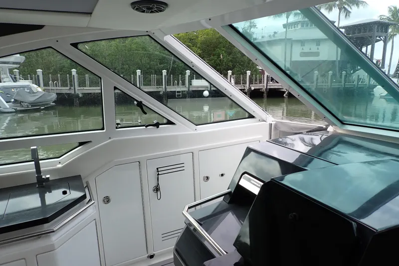 Slide: The Image of Interior view of 2024 Formula 400 Super Sport Crossover yacht, featuring sleek design and waterfront backdrop. - 16
