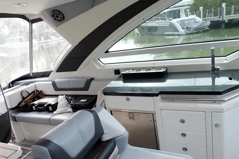 Slide: The Image of Interior of 2024 Formula 400 Super Sport Crossover yacht with sleek seating and kitchenette. - 17