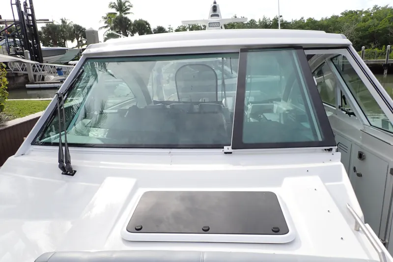 Slide: The Image of 2024 Formula 400 Super Sport Crossover boat with sleek windshield design. - 31