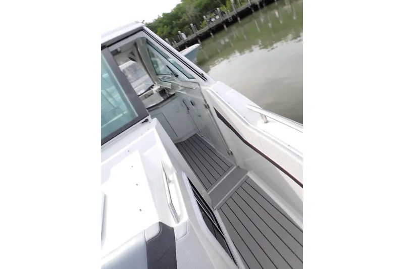 Slide: The Image of 2024 Formula 400 Super Sport Crossover boat deck with sleek design and modern features. - 32